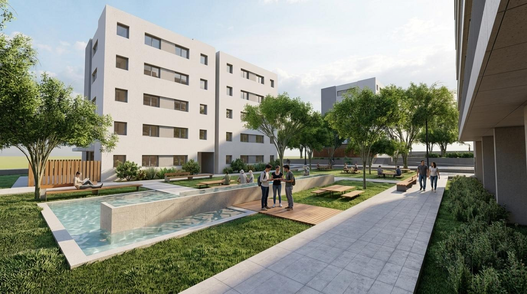 Patio ajardinado con lámina de agua entre los edificios de estudiantes