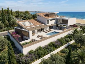 Vista aérea de vivienda unifamiliar con terrazas, piscina y vistas al mar en S'Agaró
